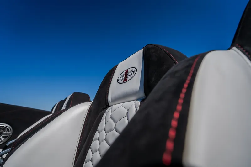 Slide: The Image of Luxurious interior of 2023 Cigarette 515 boat with quilted seats and logo. - 34