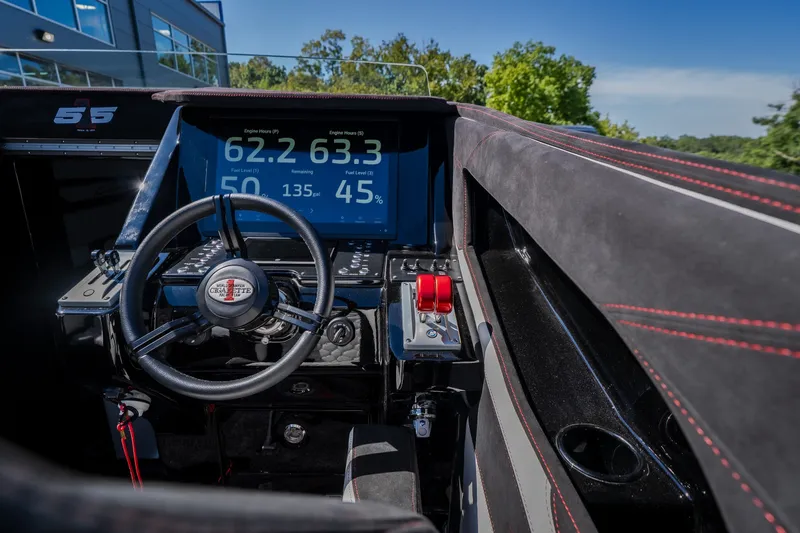 Slide: The Image of Interior cockpit of 2023 Cigarette 515 boat with digital dashboard and steering wheel. - 62