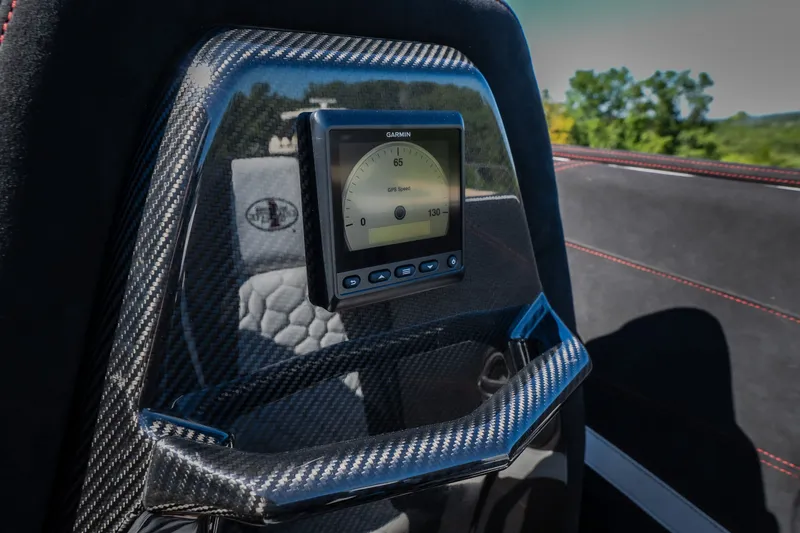 Slide: The Image of Carbon fiber dashboard with Garmin GPS in 2023 Cigarette 515 boat interior. - 31