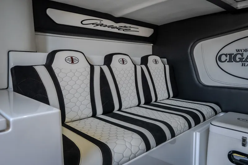 Slide: The Image of Luxurious interior seating of 2023 Cigarette 515 boat with stylish black and white design. - 76