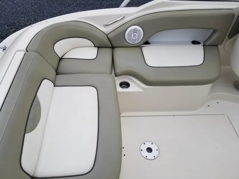 Slide: The Image of 2006 Sea Ray 270 Sundeck interior seating with beige and white upholstery. - 17