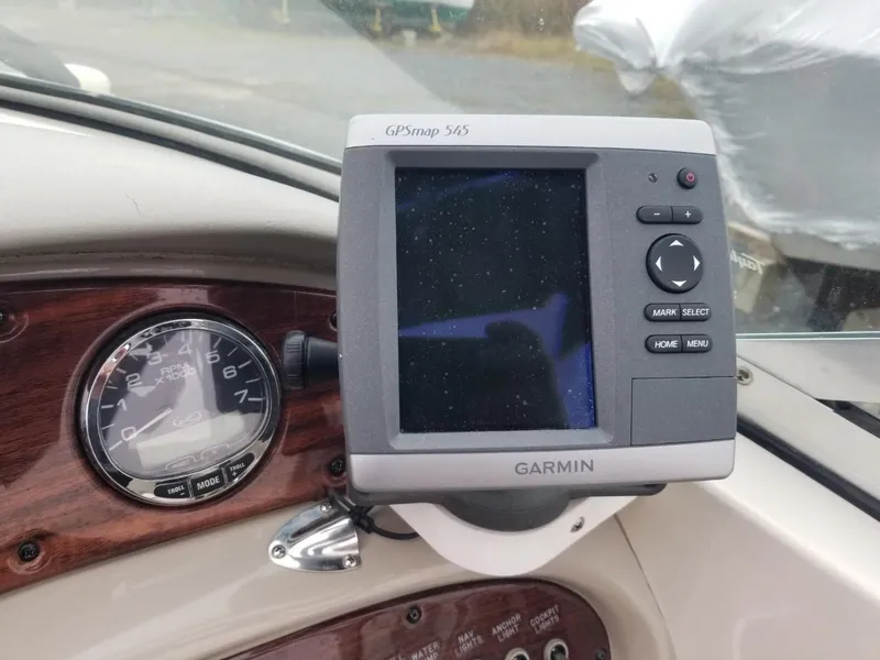 Slide: The Image of 2006 Sea Ray 270 Sundeck dashboard with Garmin GPSmap 545 and speedometer. - 24
