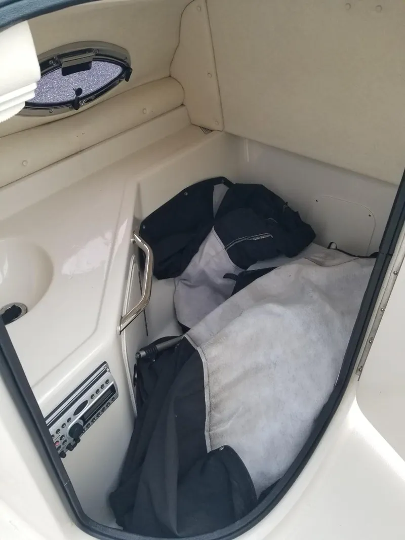 Slide: The Image of Interior cabin of 2006 Sea Ray 270 Sundeck with storage and window. - 29