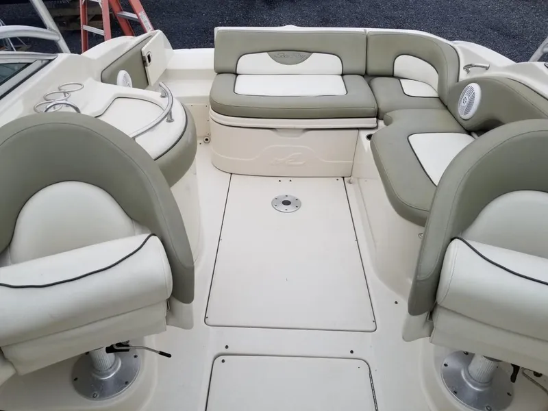 Slide: The Image of 2006 Sea Ray 270 Sundeck interior with beige seating and spacious layout. - 30