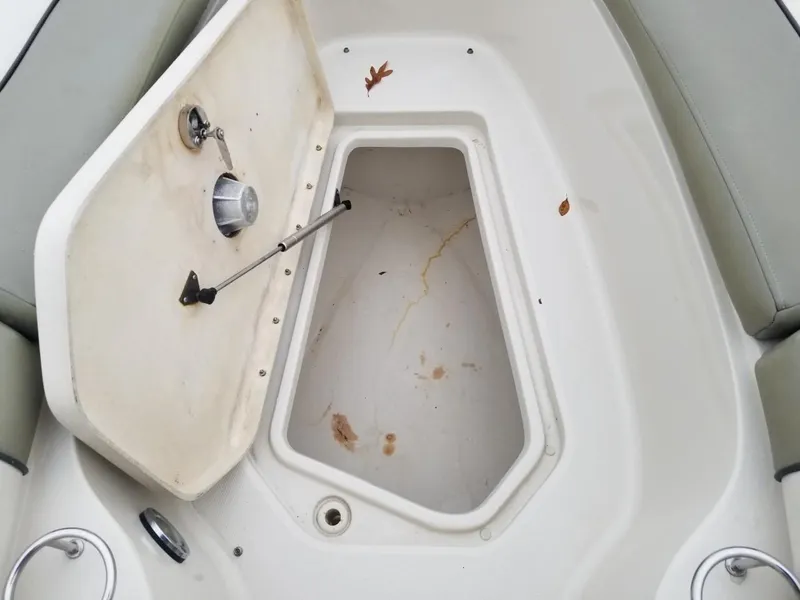 Slide: The Image of Open storage compartment on a 2006 Sea Ray 270 Sundeck boat. - 34