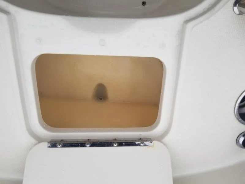 Slide: The Image of Storage compartment on a 2006 Sea Ray 270 Sundeck boat. - 35