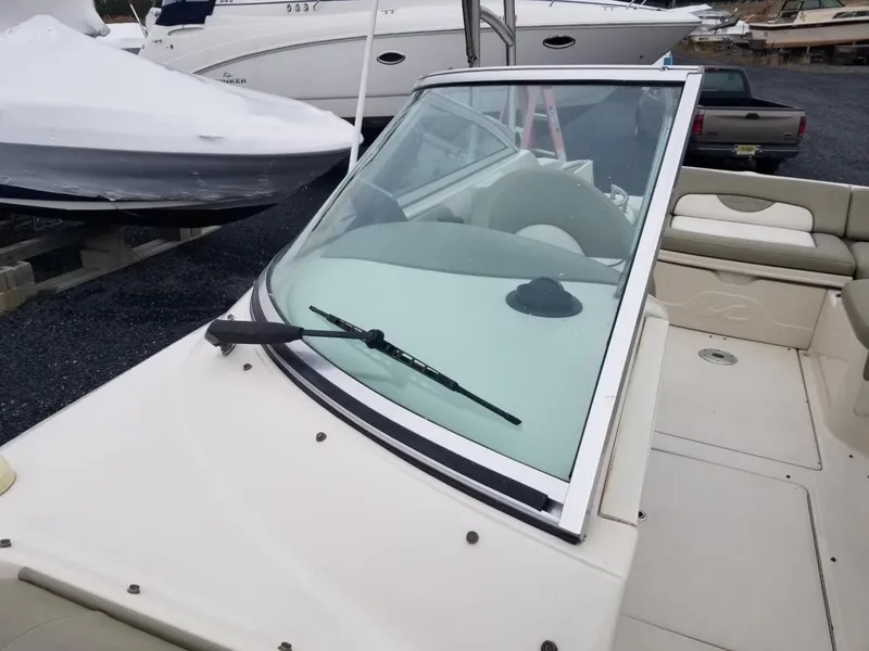 Slide: The Image of 2006 Sea Ray 270 Sundeck boat with windshield and seating area. - 37