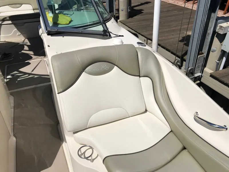Slide: The Image of 2006 Sea Ray 270 Sundeck boat with beige seating and sleek design. - 48