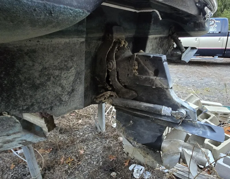 Slide: The Image of 2006 Sea Ray 270 Sundeck outdrive, showing wear and marine growth. - 7