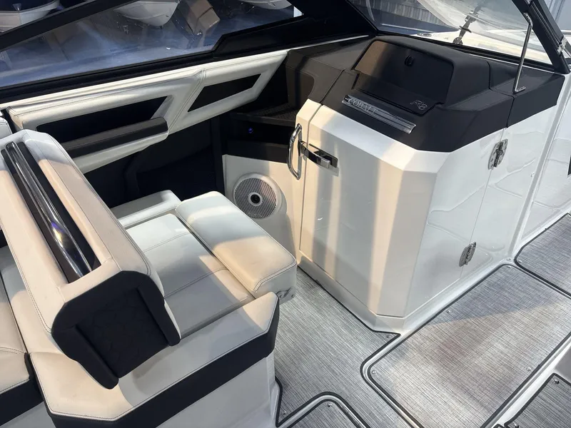 Slide: The Image of 2025 Cobalt R8 Surf boat interior with sleek seating and modern dashboard design. - 11