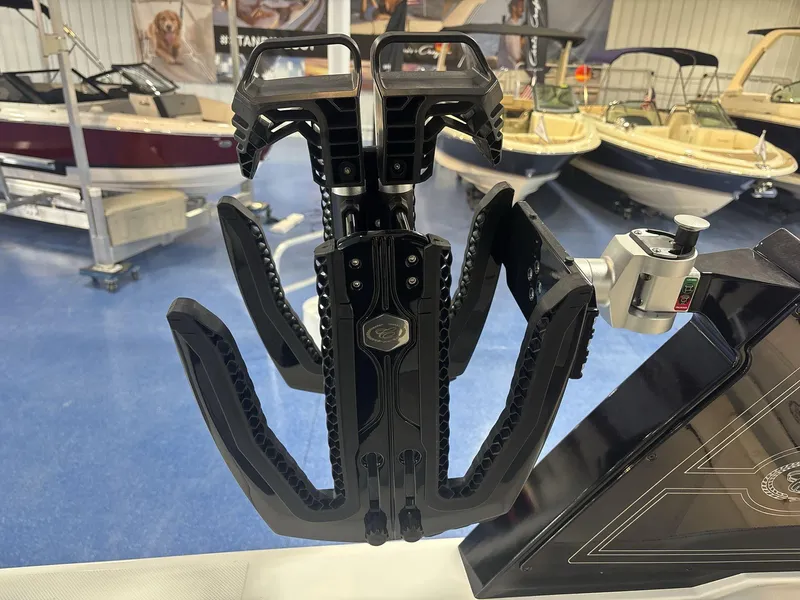 Slide: The Image of 2025 Cobalt R8 Surf boat accessory in showroom, featuring a sleek black design. - 14