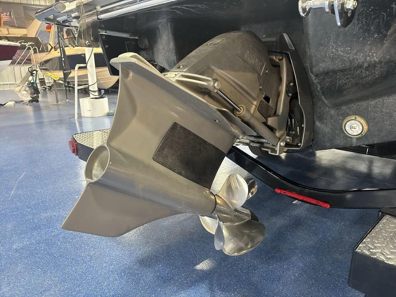 Slide: The Image of 2025 Cobalt R8 Surf boat propeller and stern drive in showroom. - 18