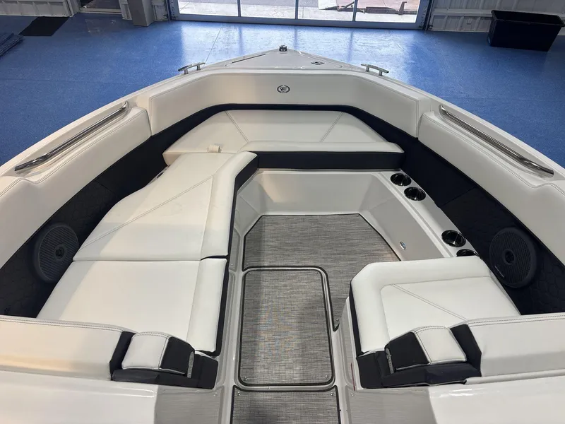 Slide: The Image of 2025 Cobalt R8 Surf boat interior with white seating and cup holders. - 7