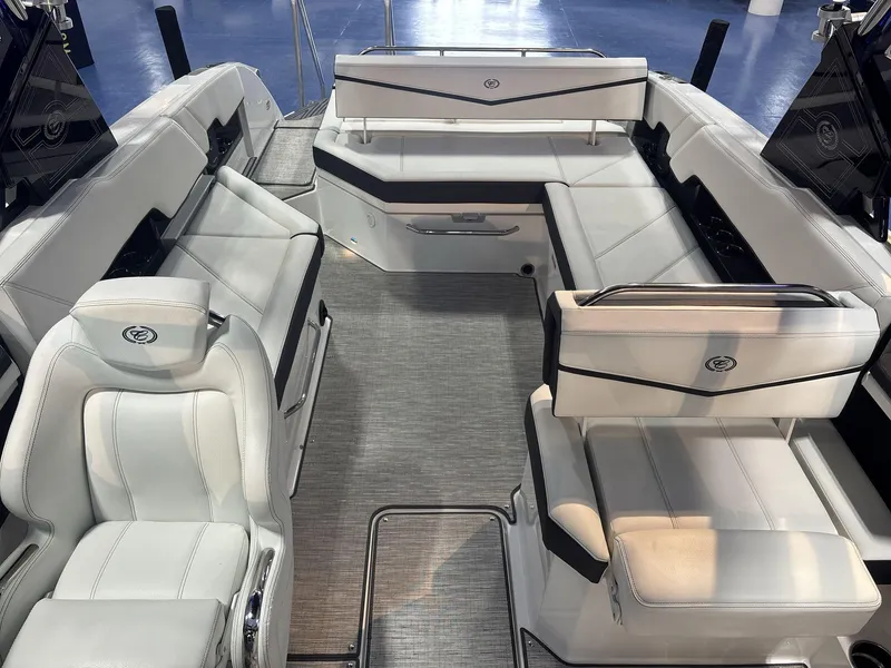 Slide: The Image of 2025 Cobalt R8 Surf boat interior with luxurious white seating and modern design. - 8