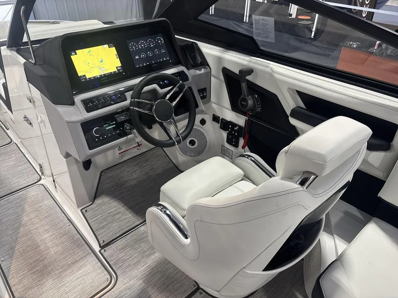 Slide: The Image of 2025 Cobalt R8 Surf boat interior with modern dashboard and steering wheel. - 9