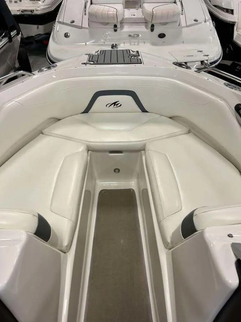Slide: The Image of 2014 Monterey 224FSX boat interior with white seating and sleek design. - 3