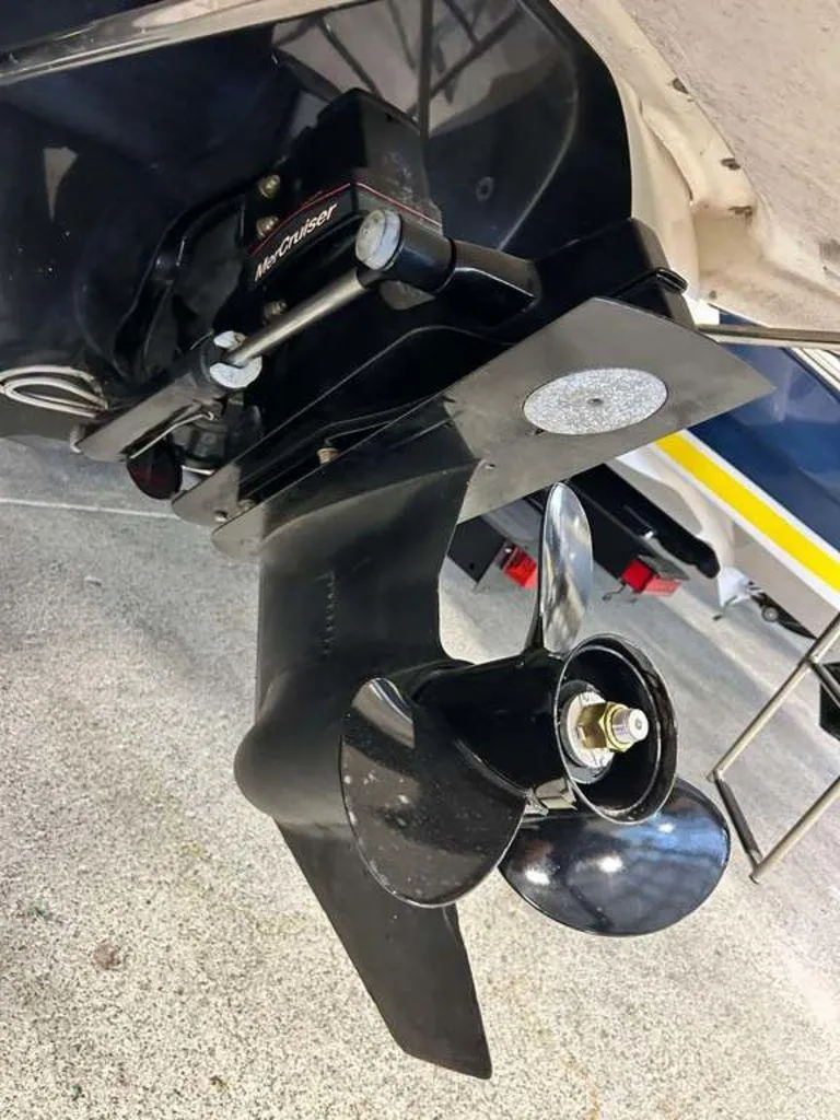 Slide: The Image of Close-up of a 2014 Monterey 224FSX boat's MerCruiser propeller and drive system. - 4