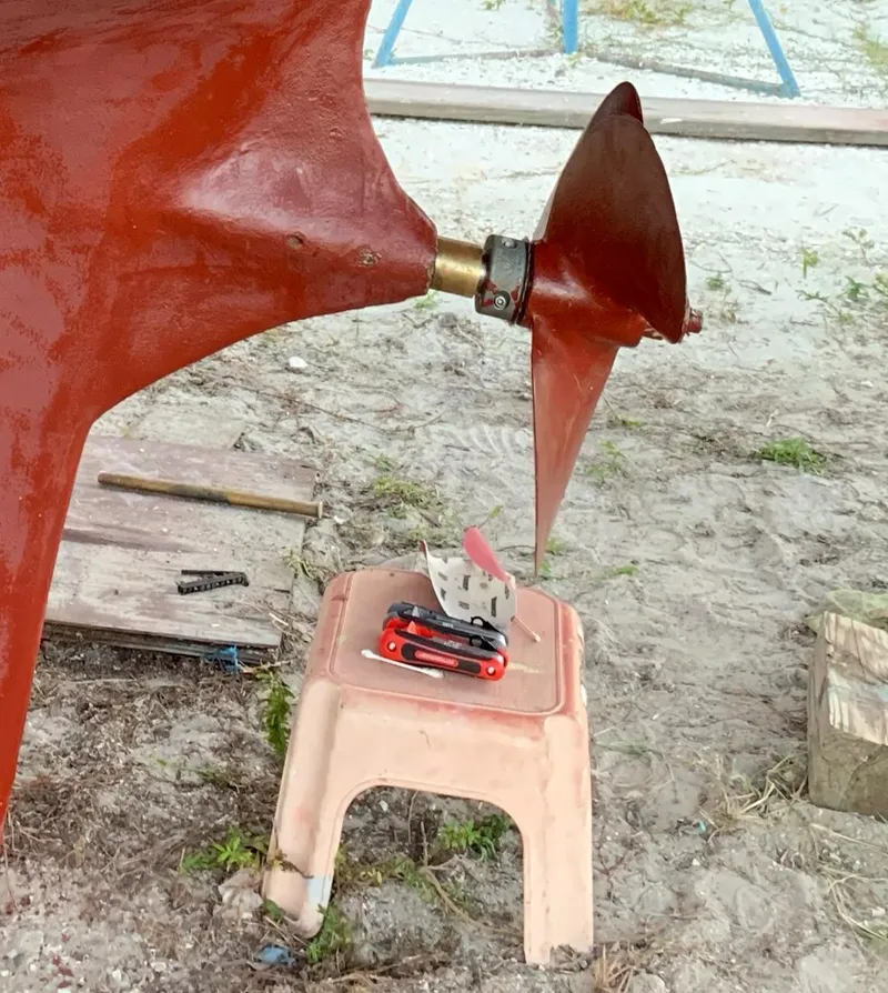 Slide: The Image of Propeller of 1980 Wellington 44 Cutter Center Cockpit with tools on a stool nearby. - 11