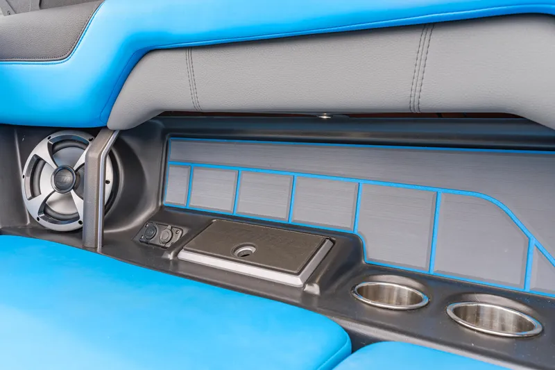 Slide: The Image of Interior of 2021 Malibu Wakesetter 25 LSV with blue seating and cup holders. - 11