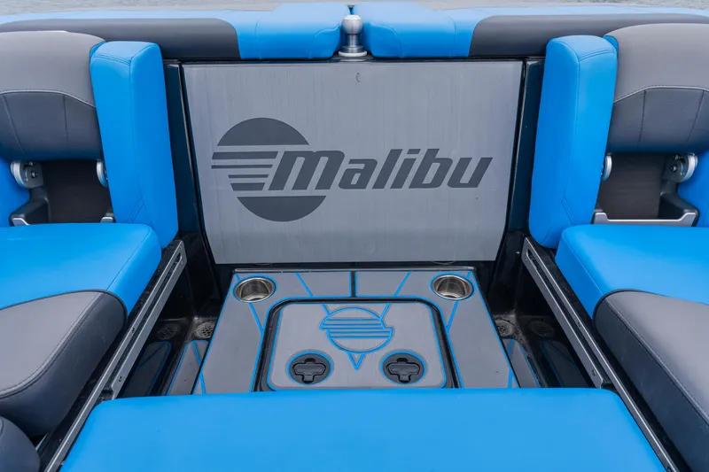 Slide: The Image of 2021 Malibu Wakesetter 25 LSV interior with blue seating and branded panel. - 15