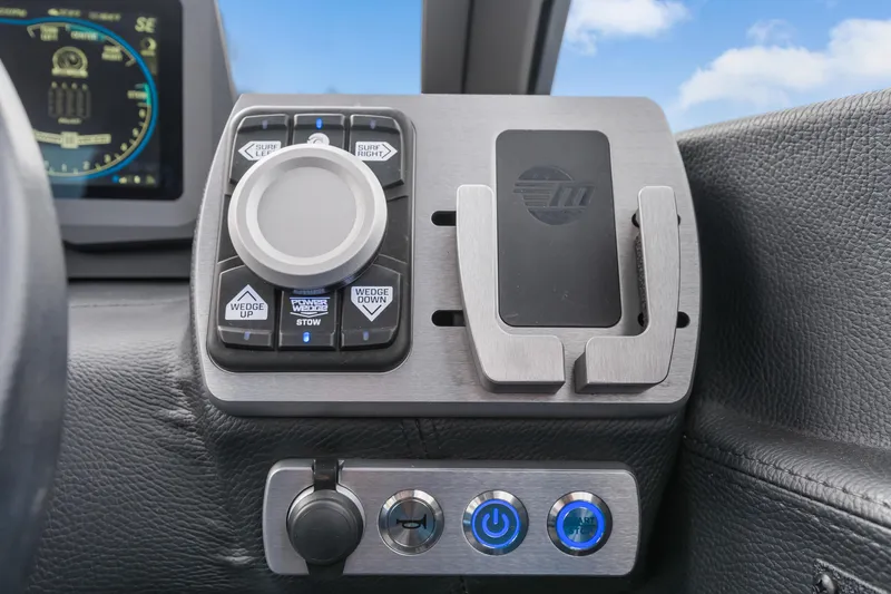 Slide: The Image of Control panel of 2021 Malibu Wakesetter 25 LSV boat with digital display and buttons. - 22