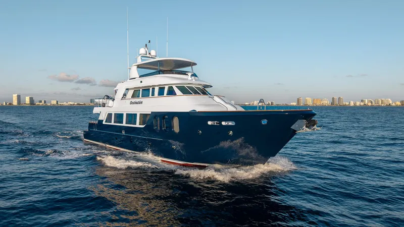 Slide: The Image of Luxury 2007 MCP Tri-Deck yacht cruising on open water with city skyline in background. - 1