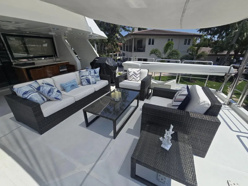 Slide: The Image of Luxurious outdoor seating on 2007 MCP Tri-Deck yacht with modern wicker furniture and cushions. - 13