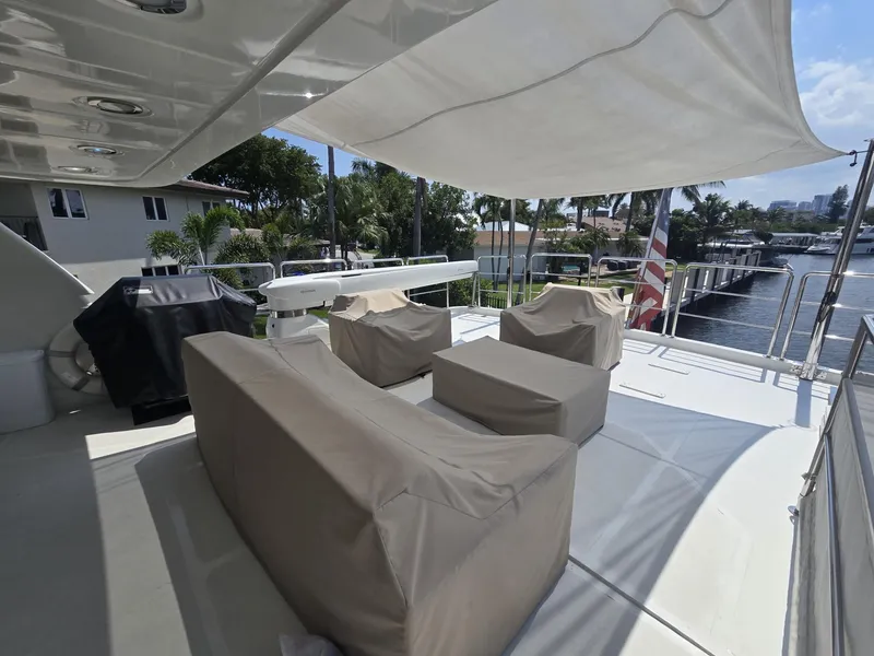 Slide: The Image of Luxury yacht deck with covered seating, featuring MCP Tri-Deck 2007 model. - 18