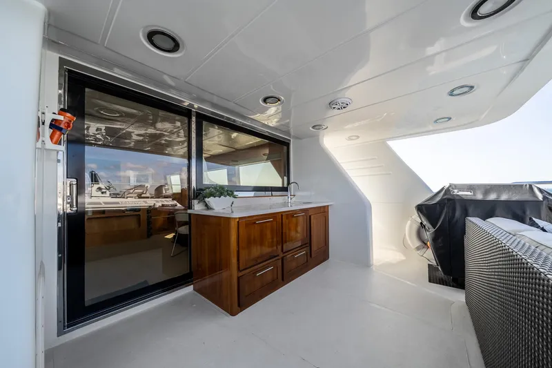 Slide: The Image of Luxurious 2007 MCP Tri-Deck yacht interior with sleek cabinetry and modern design elements. - 19