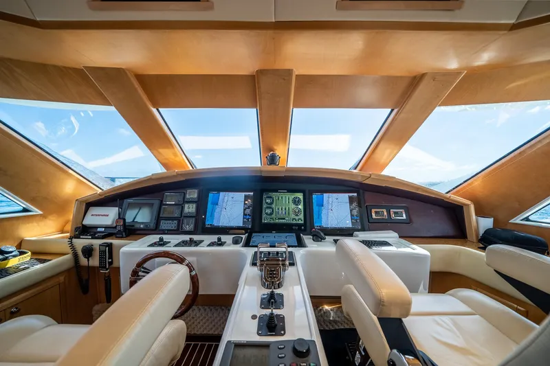 Slide: The Image of Luxurious 2007 MCP Tri-Deck yacht helm with advanced navigation systems and plush seating. - 34