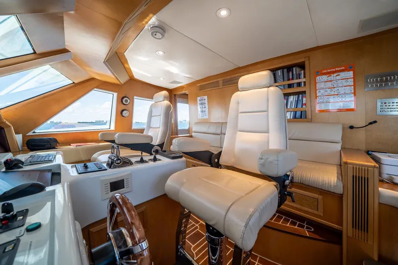 Slide: The Image of Luxurious 2007 MCP Tri-Deck yacht interior with plush seating and modern navigation equipment. - 35