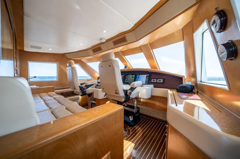 Slide: The Image of Luxurious 2007 MCP Tri-Deck yacht interior with plush seating and modern navigation equipment. - 36