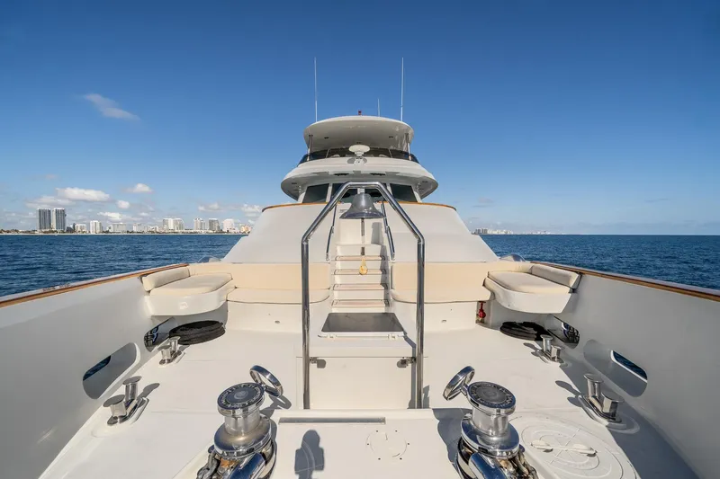 Slide: The Image of Luxury MCP Tri-Deck yacht deck, 2007 model, cruising on open sea with city skyline in background. - 4