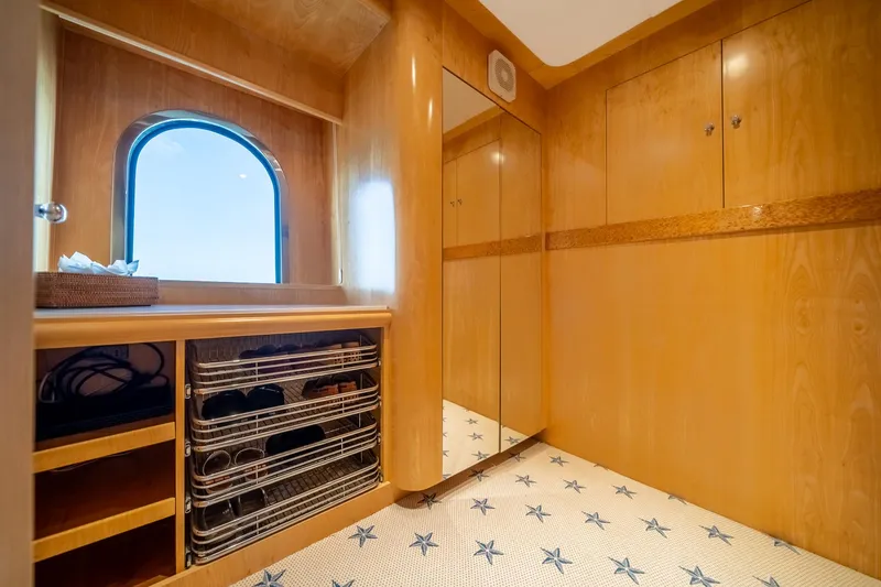 Slide: The Image of Luxurious wooden interior of 2007 MCP Tri-Deck yacht with storage and window. - 40