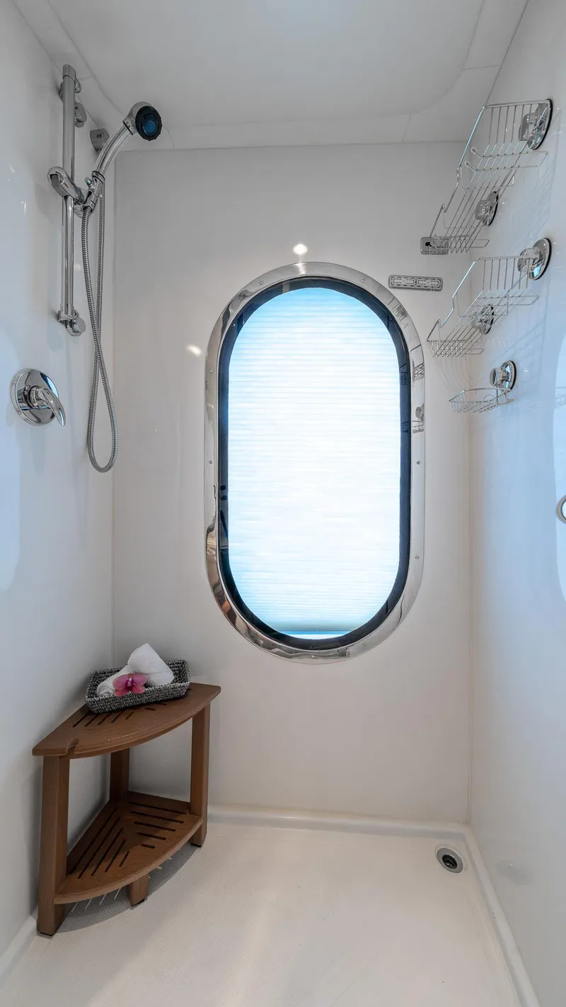 Slide: The Image of Luxurious yacht shower with oval window, wooden corner shelf, and chrome fixtures. MCP Tri-Deck 2007. - 42