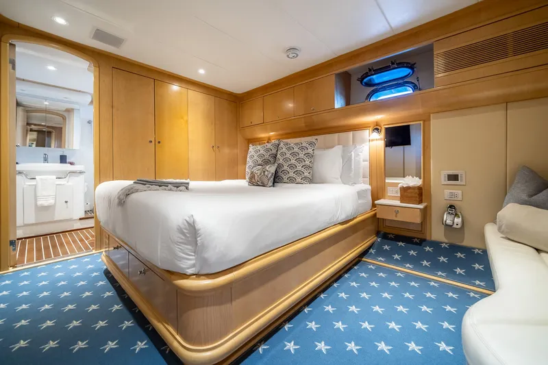Slide: The Image of Luxurious bedroom on 2007 MCP Tri-Deck yacht with elegant decor and plush bedding. - 43