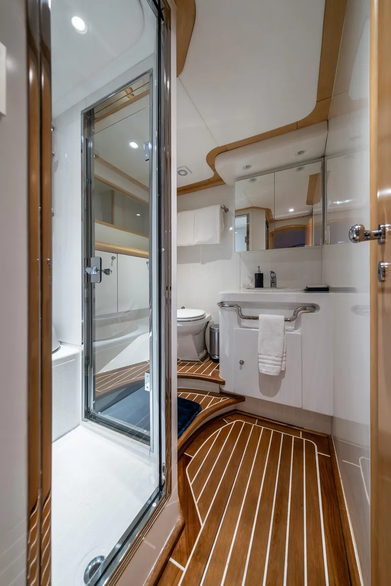 Slide: The Image of Luxurious bathroom on 2007 MCP Tri-Deck yacht with modern fixtures and wooden flooring. - 53