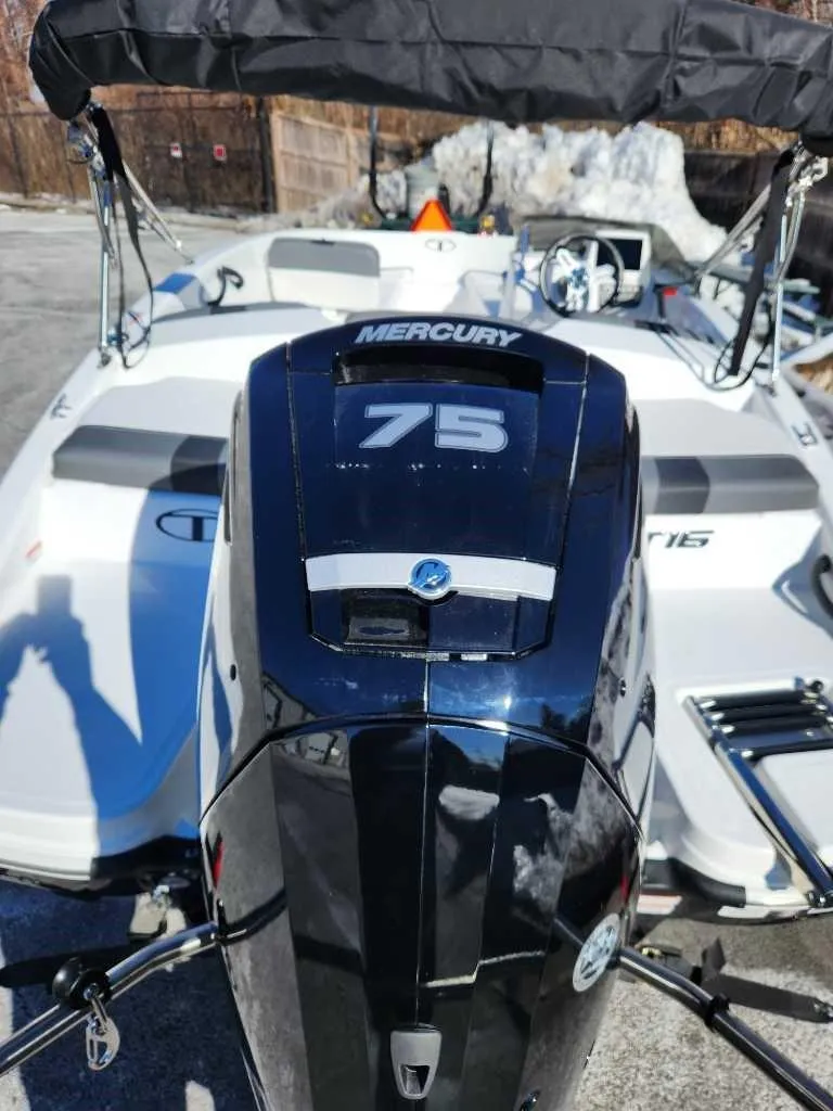 Slide: The Image of 2025 Tahoe T16 boat with Mercury 75 engine, rear view. - 3