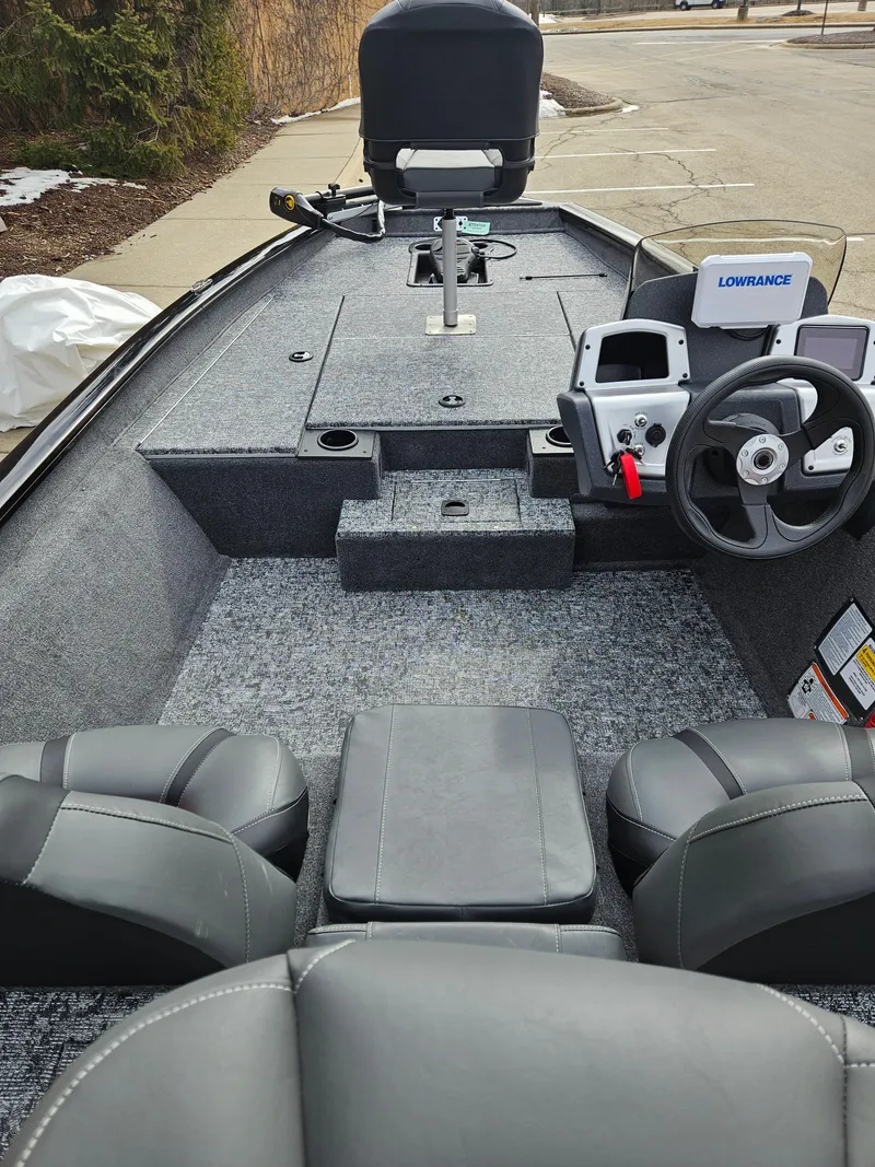 Slide: The Image of 2025 Tracker Pro Team 175 boat interior with steering console and seating. - 3