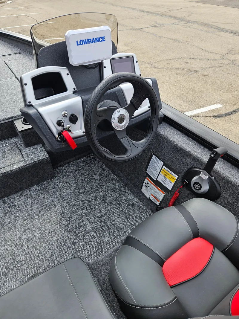 Slide: The Image of 2025 Tracker Pro Team 175 boat interior with steering wheel and Lowrance electronics. - 4