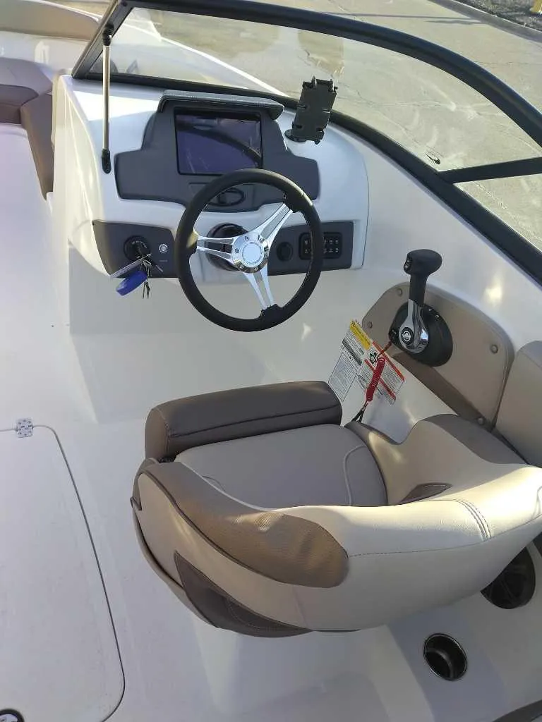 Slide: The Image of 2025 Tahoe 210 S boat cockpit with steering wheel and control panel. - 4