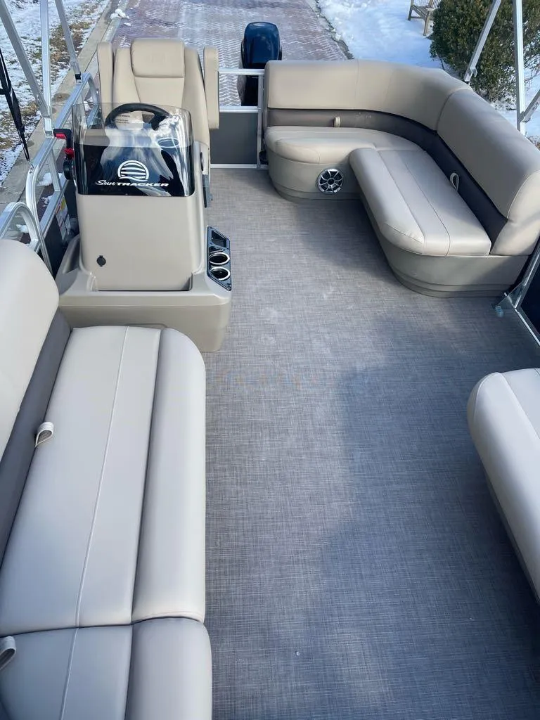 Slide: The Image of 2025 Sun Tracker Party Barge 16 DLX interior with spacious seating and modern design. - 5
