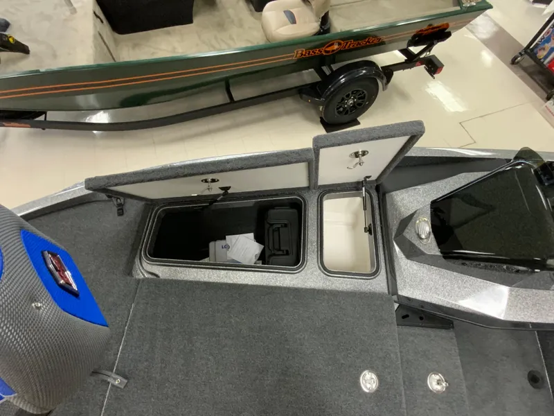 Slide: The Image of 2025 Ranger Z185 boat interior with open storage compartments and sleek design. - 13