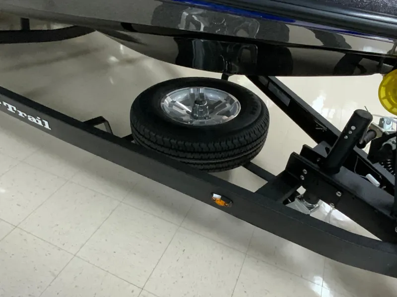 Slide: The Image of 2025 Ranger Z185 boat trailer with spare tire on showroom floor. - 7