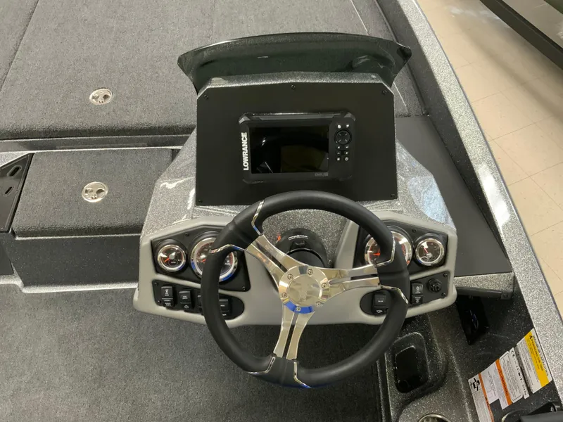 Slide: The Image of 2025 Ranger Z185 boat dashboard with steering wheel and navigation system. - 8