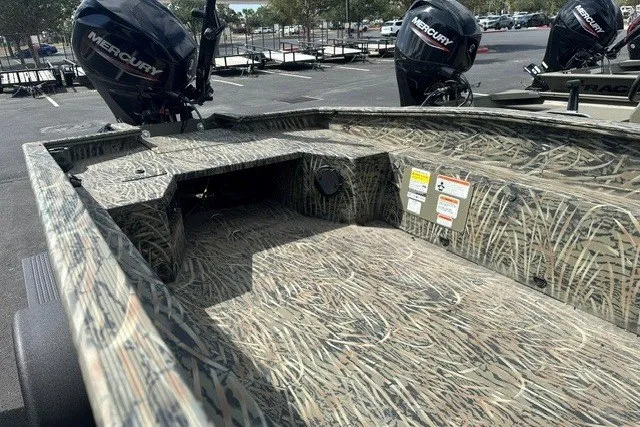 Slide: The Image of 2025 Tracker Grizzly 1650 T Prairie Wings Edition boat with camouflage design and Mercury engines. - 6