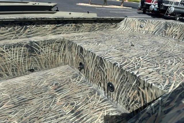 Slide: The Image of 2025 Tracker Grizzly 1650 T Prairie Wings Edition with camouflage interior design. - 8