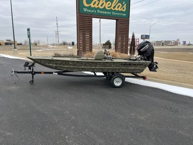 The Image of 2025 Tracker Grizzly 1648 SC boat on trailer near Cabela's sign. - 0