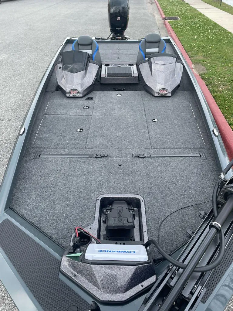 Slide: The Image of 2025 Ranger RT198P fishing boat interior with dual seats and trolling motor. - 2