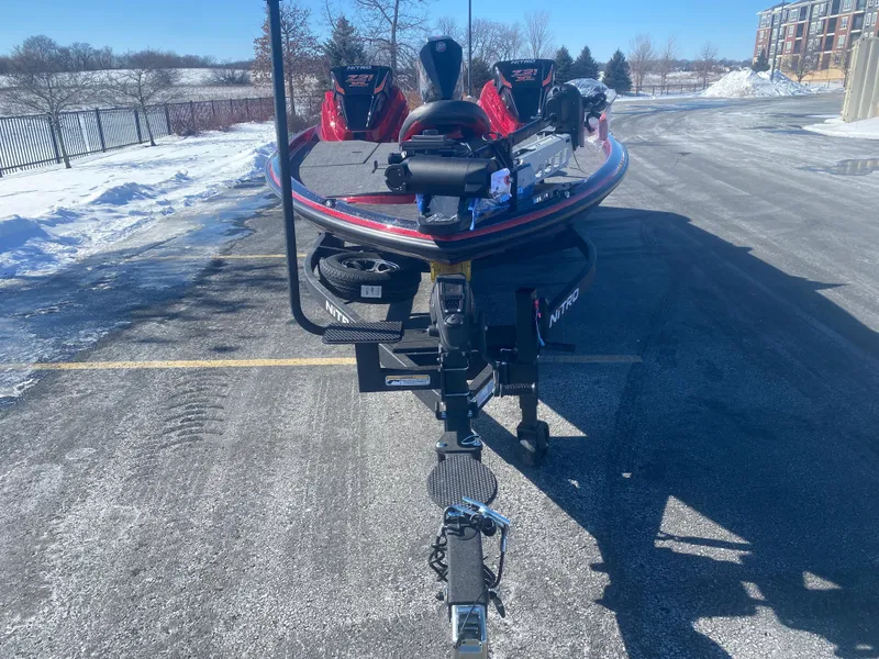 Slide: The Image of 2025 Nitro Z21 XL Pro boat on snowy parking lot, front view. - 2